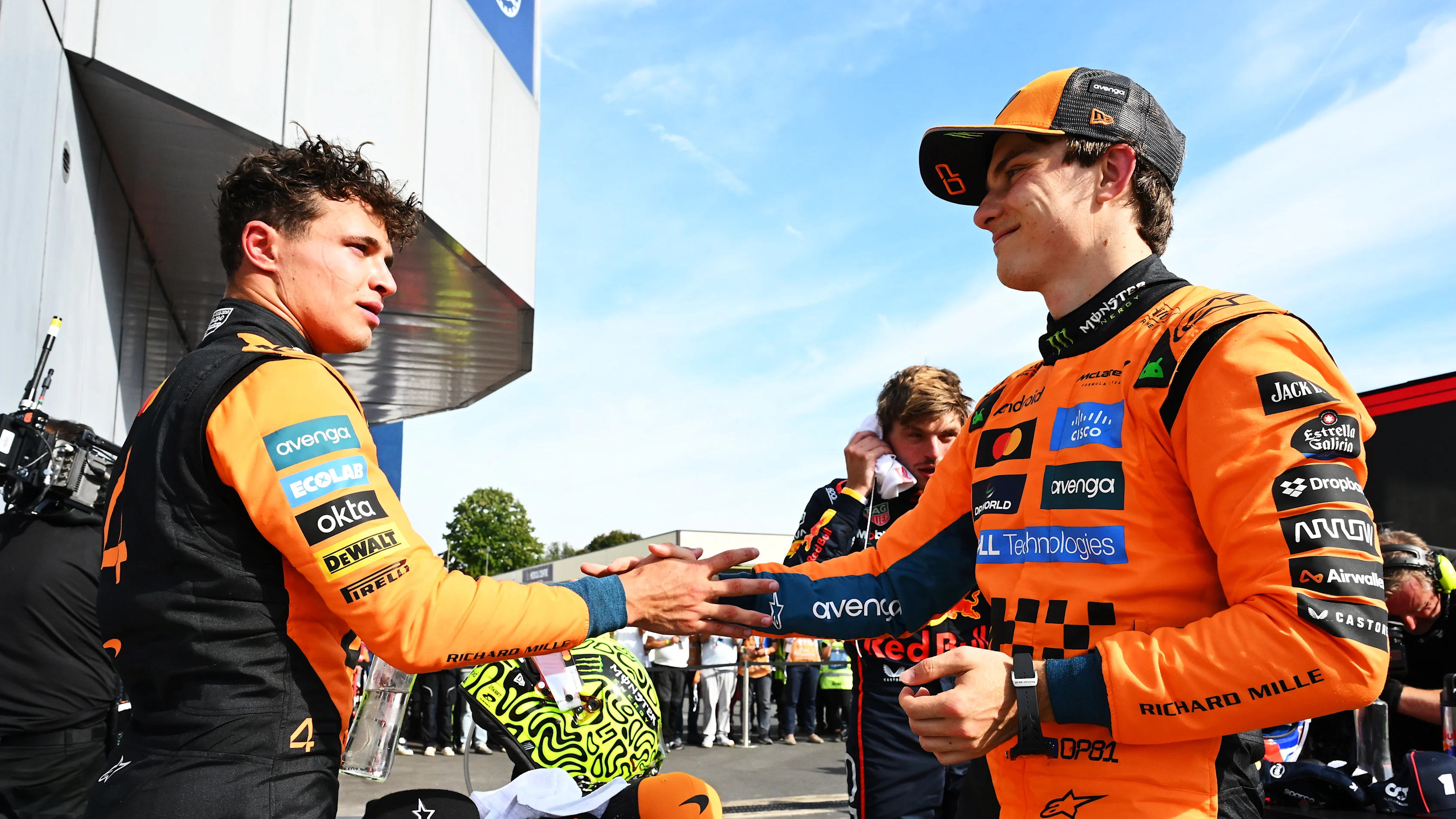 MONZA, ITALY - SEPTEMBER 07: Second placed Lando Norris of Great Britain and McLaren and Third placed Oscar Piastri of Australia and McLaren congralate each other in parc ferme during the F1 Grand Prix of Italy at Autodromo Nazionale Monza on September 07, 2025 in Monza, Italy. (Photo by Mark Sutton - Formula 1/Formula 1 via Getty Images)