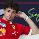 SINGAPORE, SINGAPORE - OCTOBER 02: Charles Leclerc of Monaco and Scuderia Ferrari looks on in the Drivers Press Conference during previews ahead of the F1 Grand Prix of Singapore at Marina Bay Street Circuit on October 02, 2025 in Singapore, Singapore. (Photo by Bryn Lennon/Getty Images)